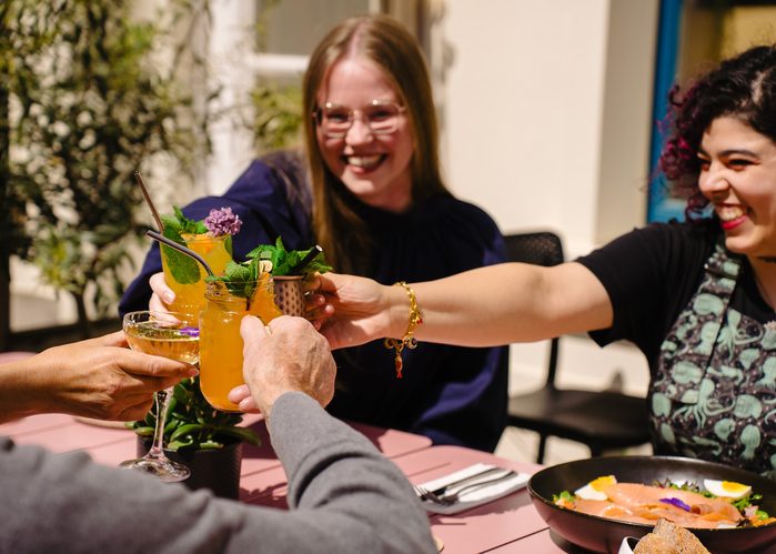 Guests sharing drinks at Dalu