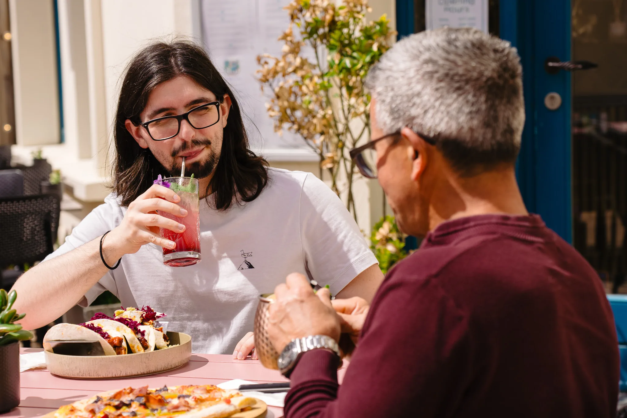 Guests enjoying drinks and food on the Dalu terrace